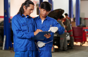 two mechanic making preparations