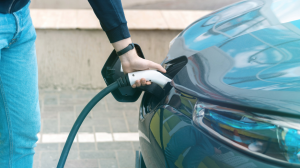 image of person charging car battery