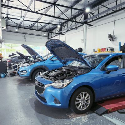 Cars With Open Hood For Servicing at Garage