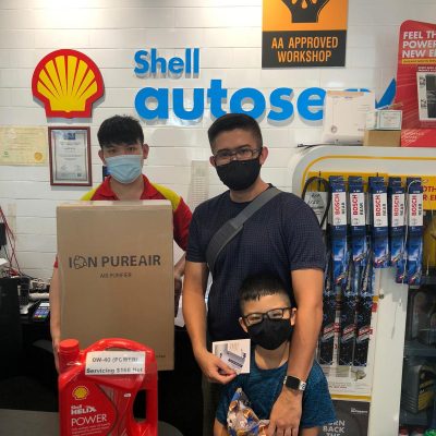 a man with shell helix power engine oil